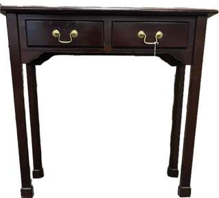 Antique wooden desk with a solid wood frame, carved detailing, and multiple drawers, featuring a rich aged finish and classic vintage design